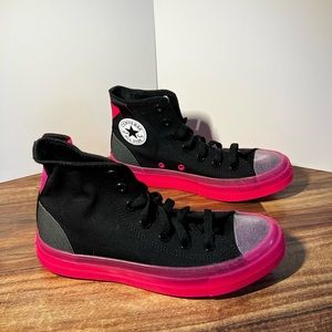 Black and pink high top converse